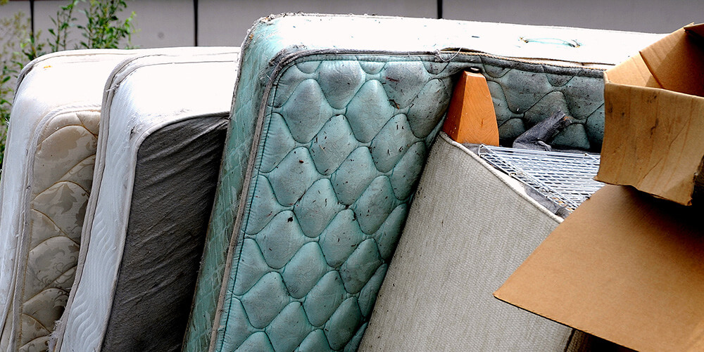 Recycled furniture ready to be picked up outdoors.